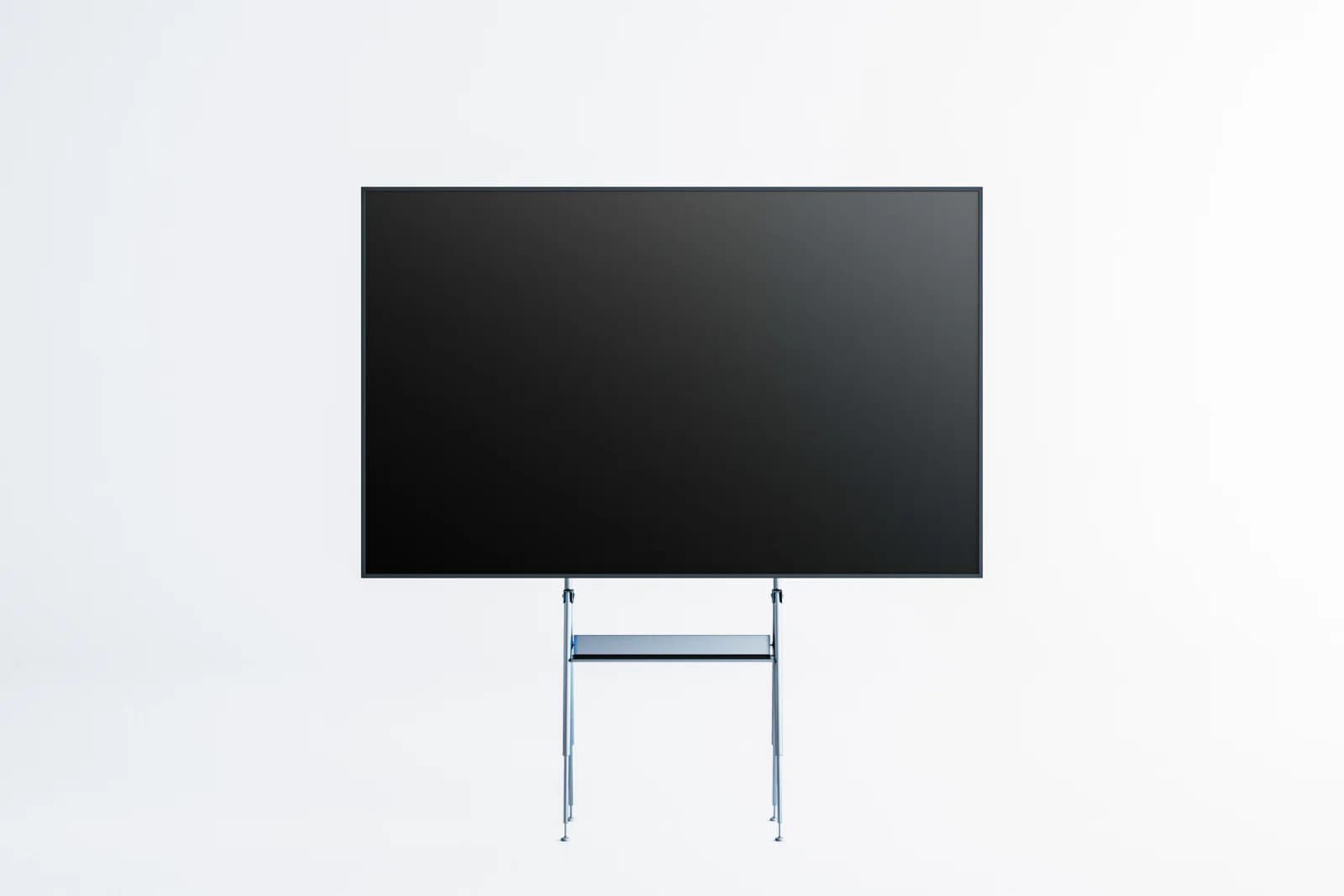 Large TV display on a stand in a trade show booth showing branded presentation content