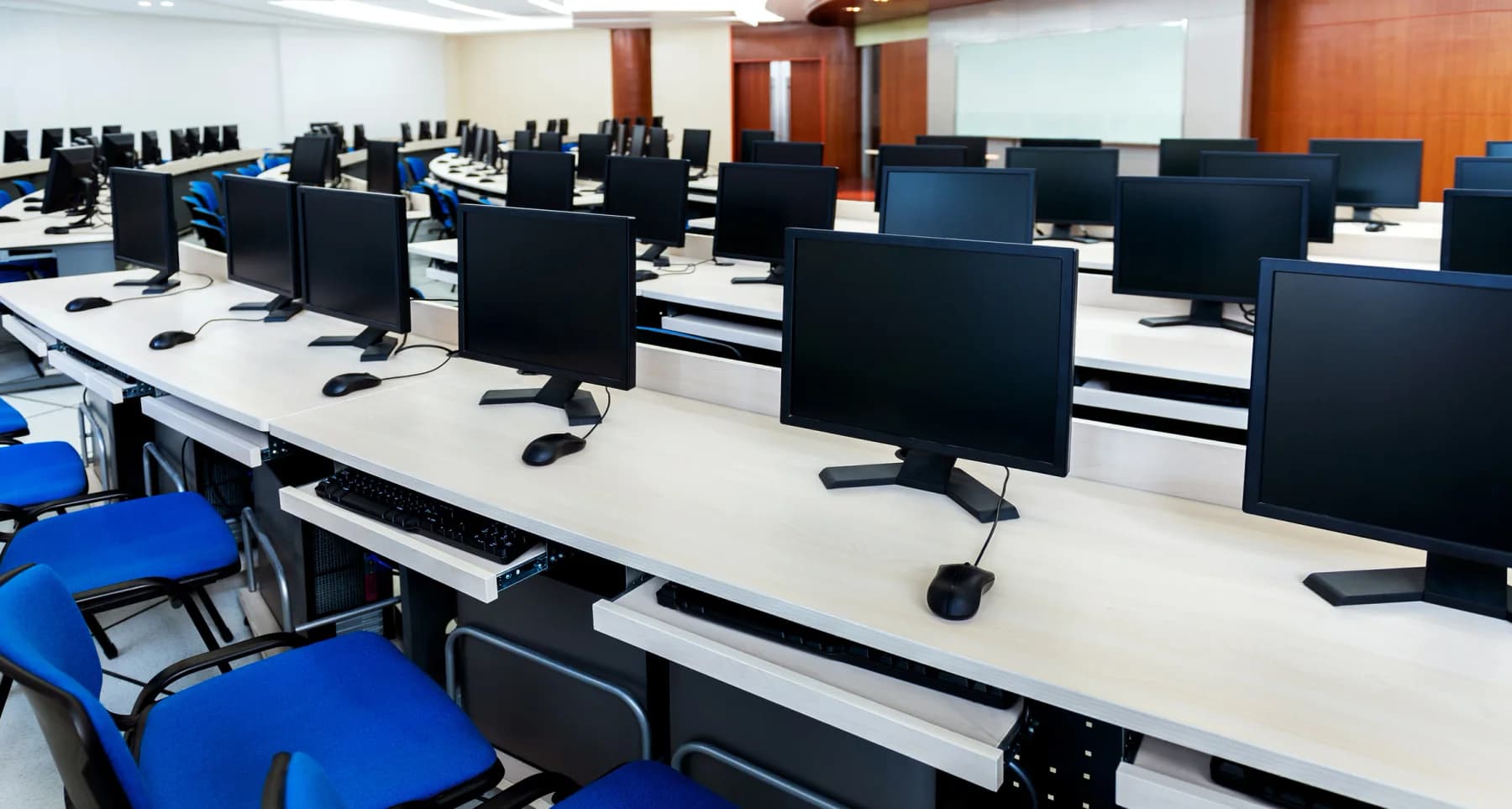 Desktop computer rentals set up in a business training room and temporary office environment