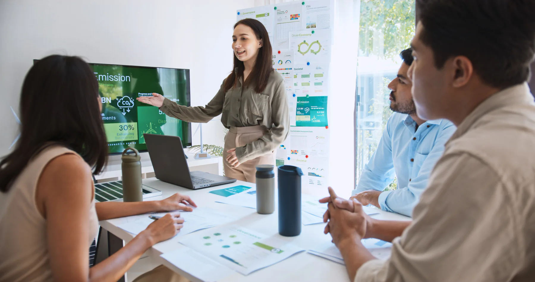 Corporate training classroom with standardized rental laptops, instructor presentation equipment, and learner-ready technology staged for a live session