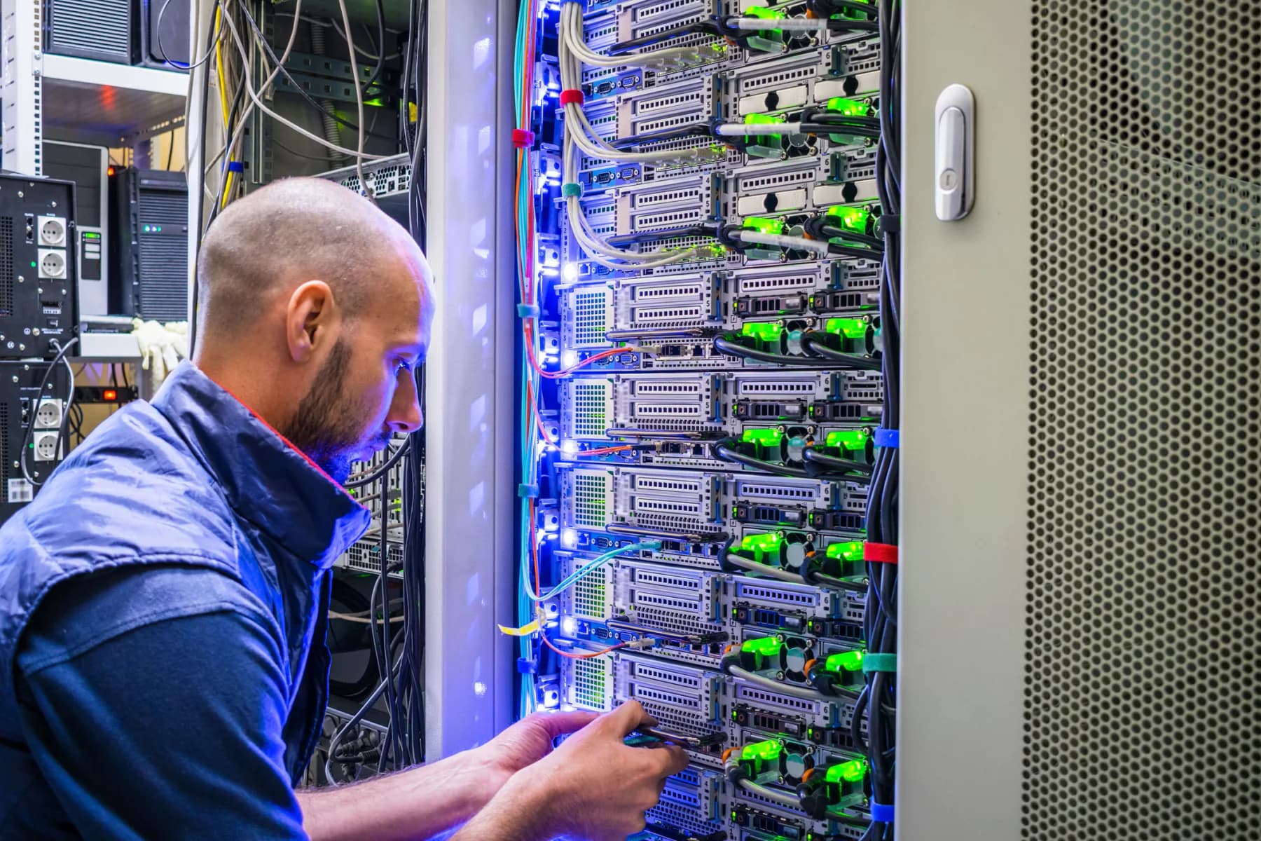 Rental servers and network switches installed in a temporary data center environment for infrastructure testing and backend operations
