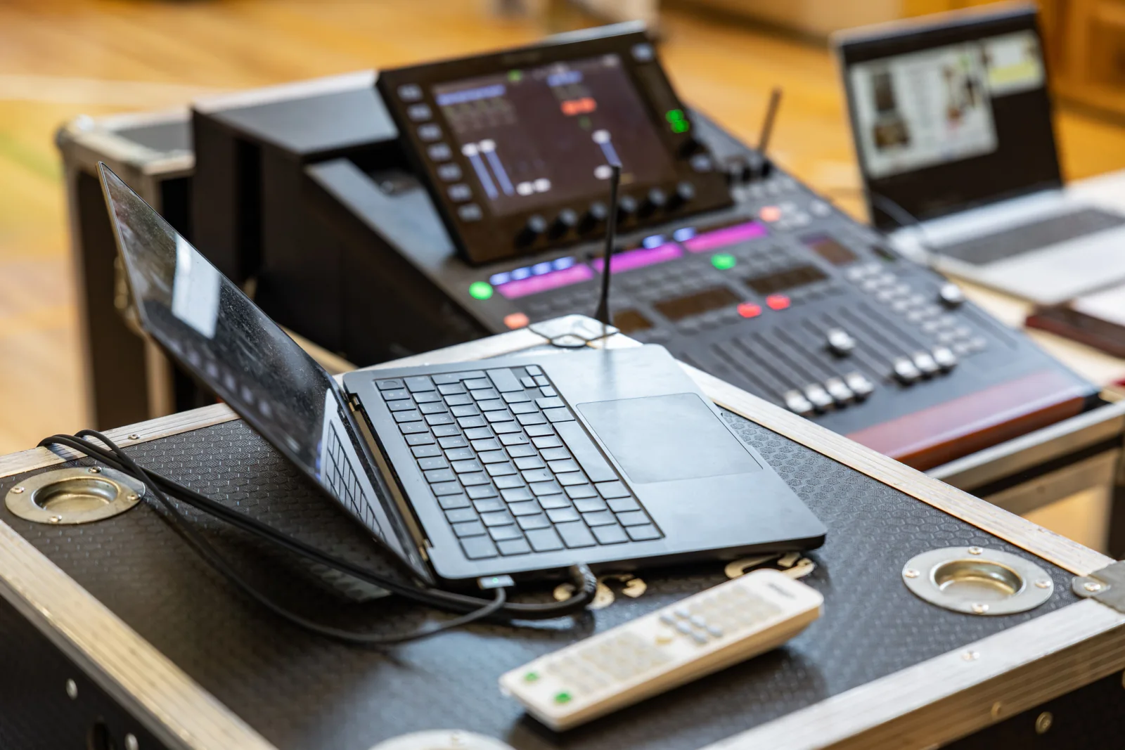 Control table managing cameras and streaming equipment for a hybrid conference with live and remote attendees