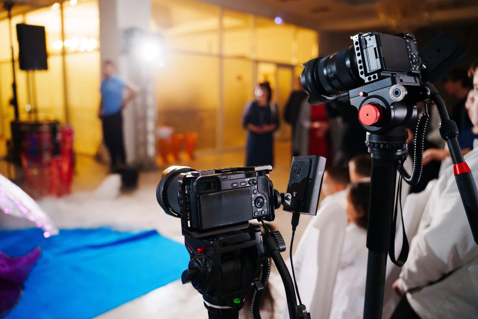 Presenter on camera delivering a webinar from a professional remote presentation setup with lighting and audio