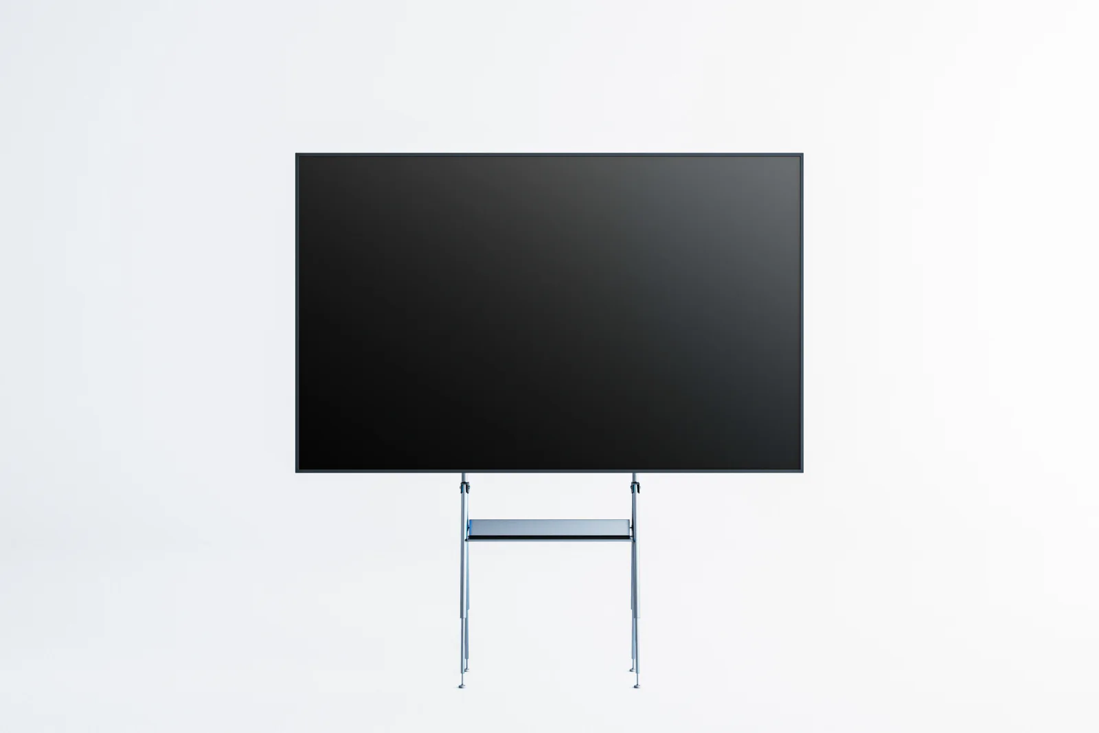 Large TV display on a stand in a trade show booth showing branded presentation content