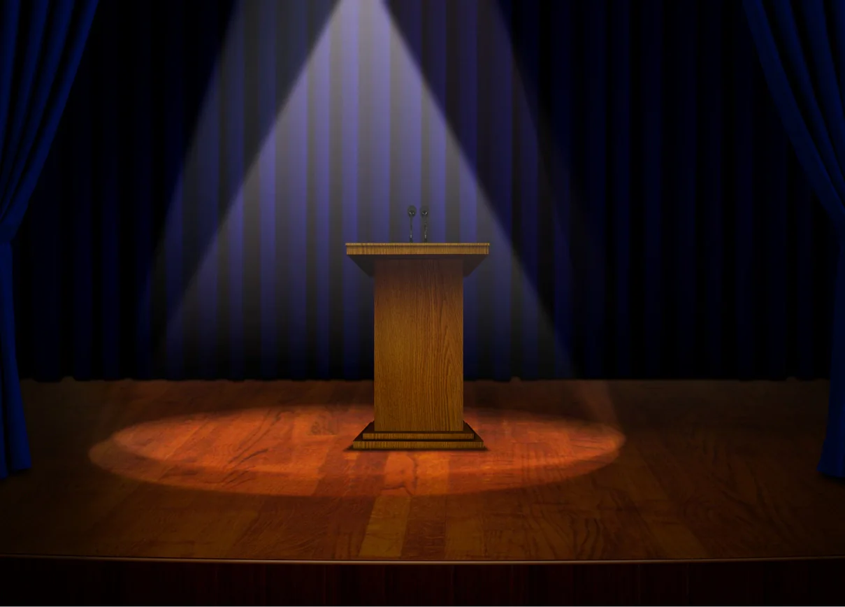 Spotlight focused on a podium during a business presentation or keynote moment