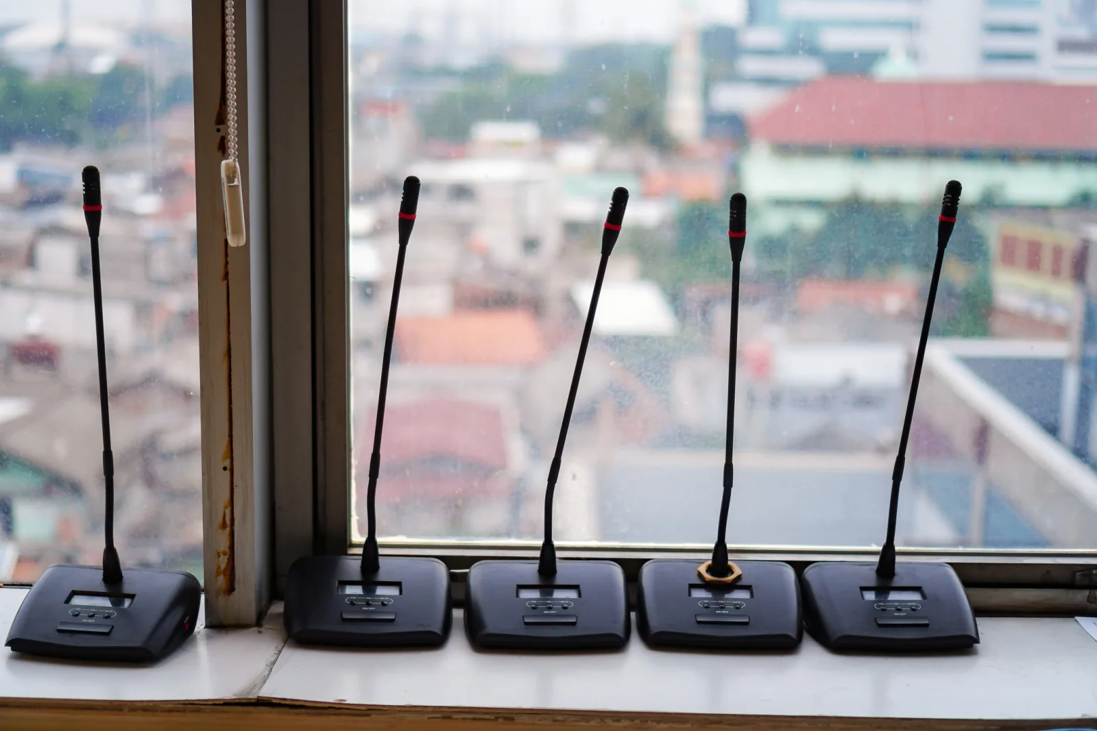 Wireless microphones and receivers staged for keynote speakers panel sessions and training presentations