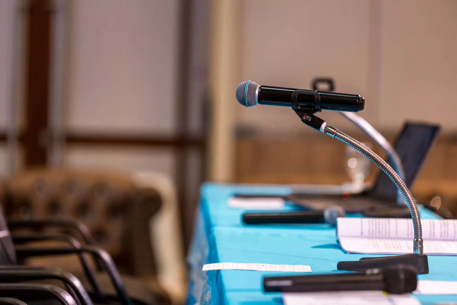 Conference room audio setup with speakers and microphone for business meeting or panel discussion