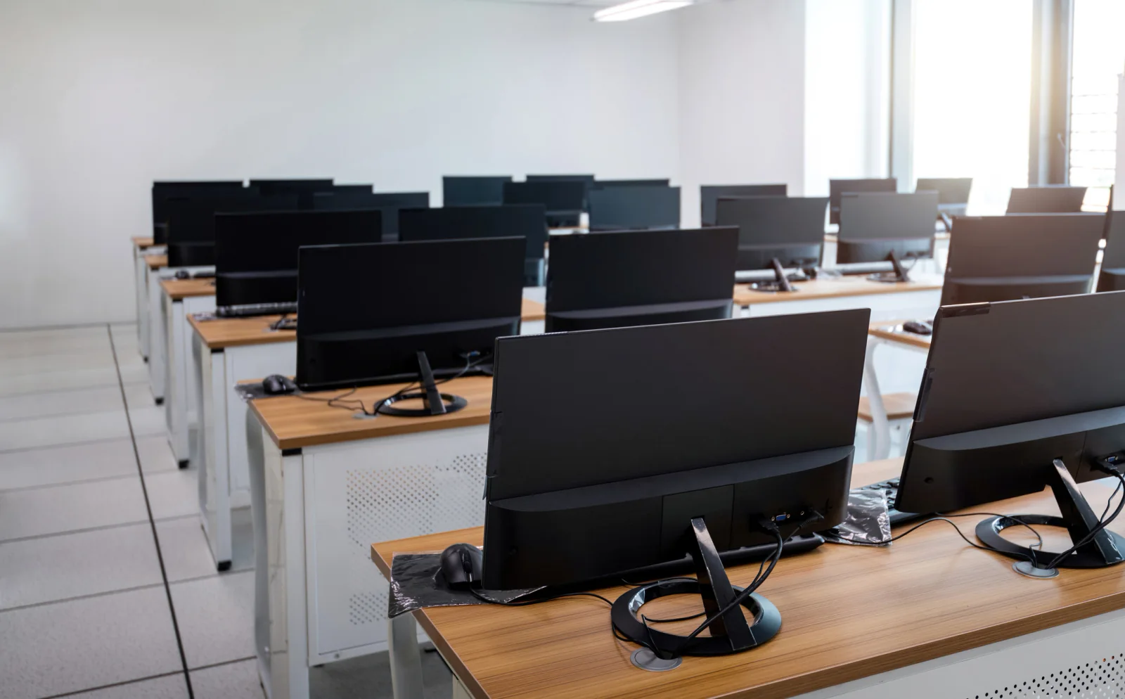 Large quantity computer deployment with boxed desktop equipment prepared for enterprise rollout and temporary office installation