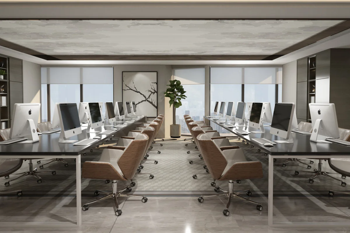 Business desktop computers arranged in a modern office and training room environment for temporary staff and productivity work