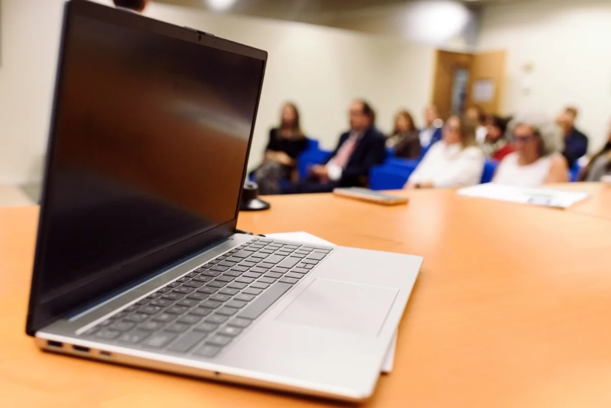 Large company meeting room with rental microphones, display, projector, and sound reinforcement for clear communication