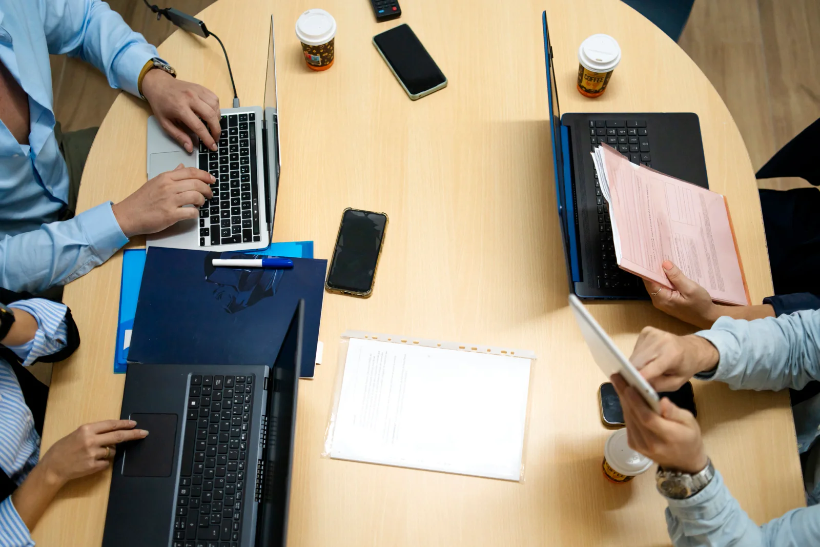 Temporary regional campaign office with organizers using laptops, printers, and networking equipment