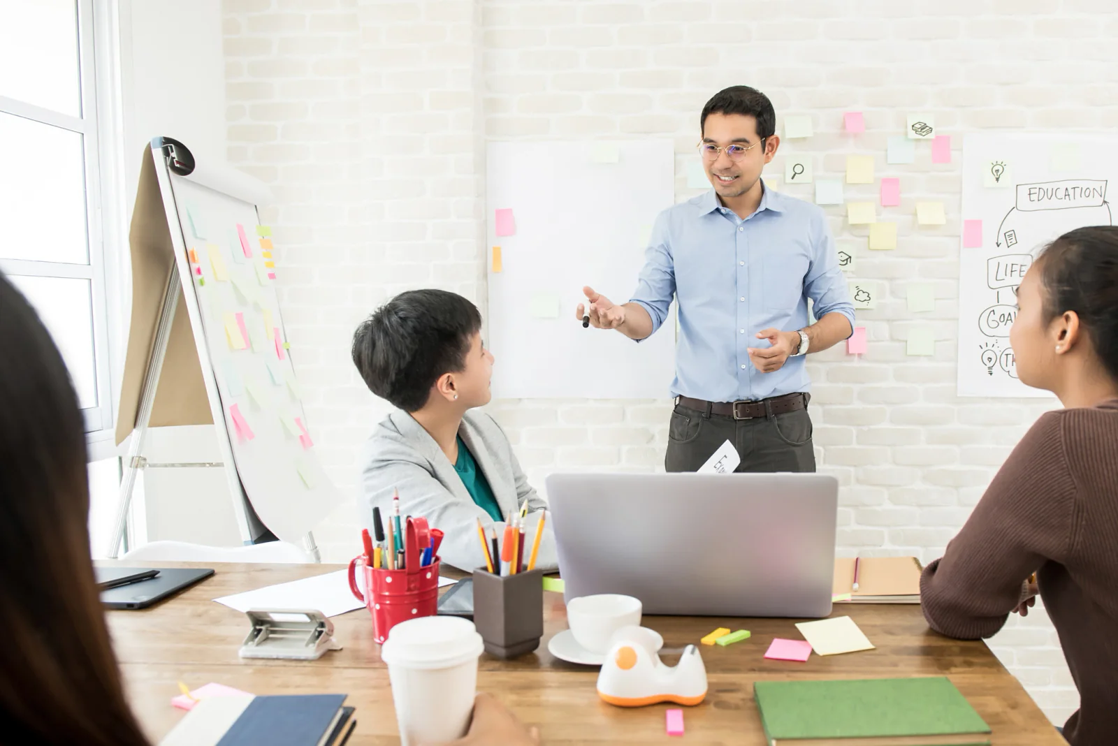 Small business hosting a client presentation with a projector and screen