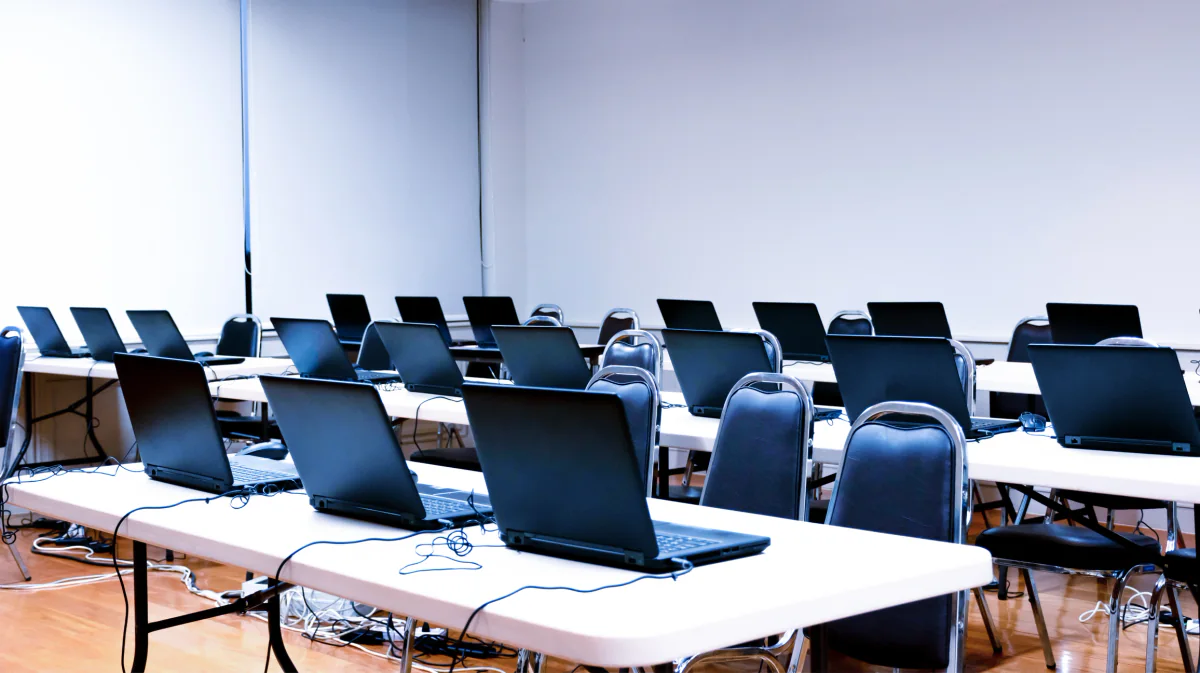 Training room with rows of desktop computers prepared for software instruction and classroom use