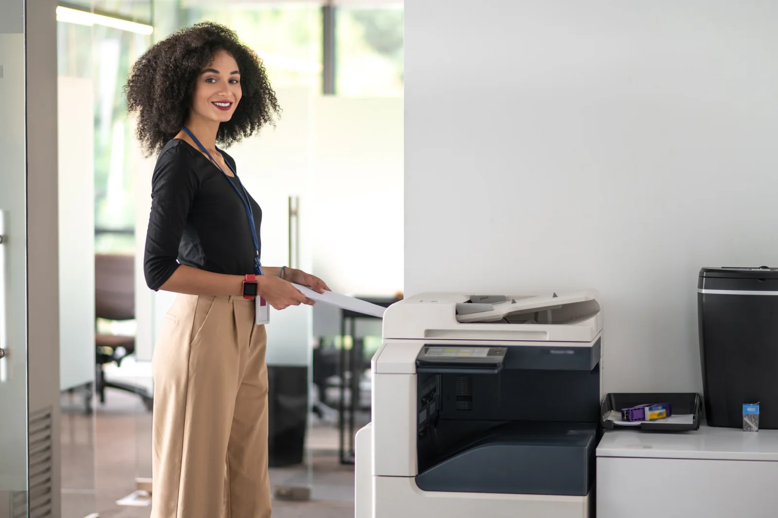 Black and white office copier in a hallway for temporary business printing and copying workflows