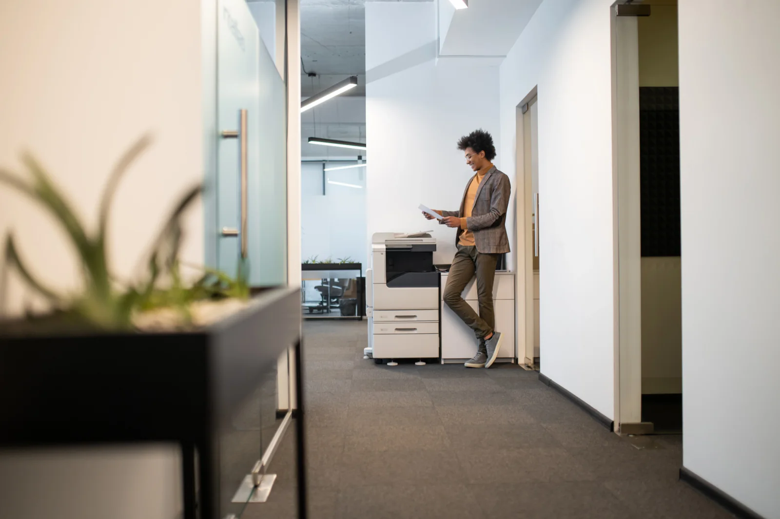 Event operations room with a copier and printed materials for conference and admin support