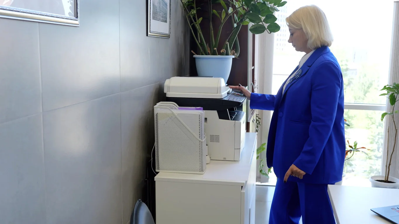 Office with multiple copiers handling a large temporary document workload during a busy season