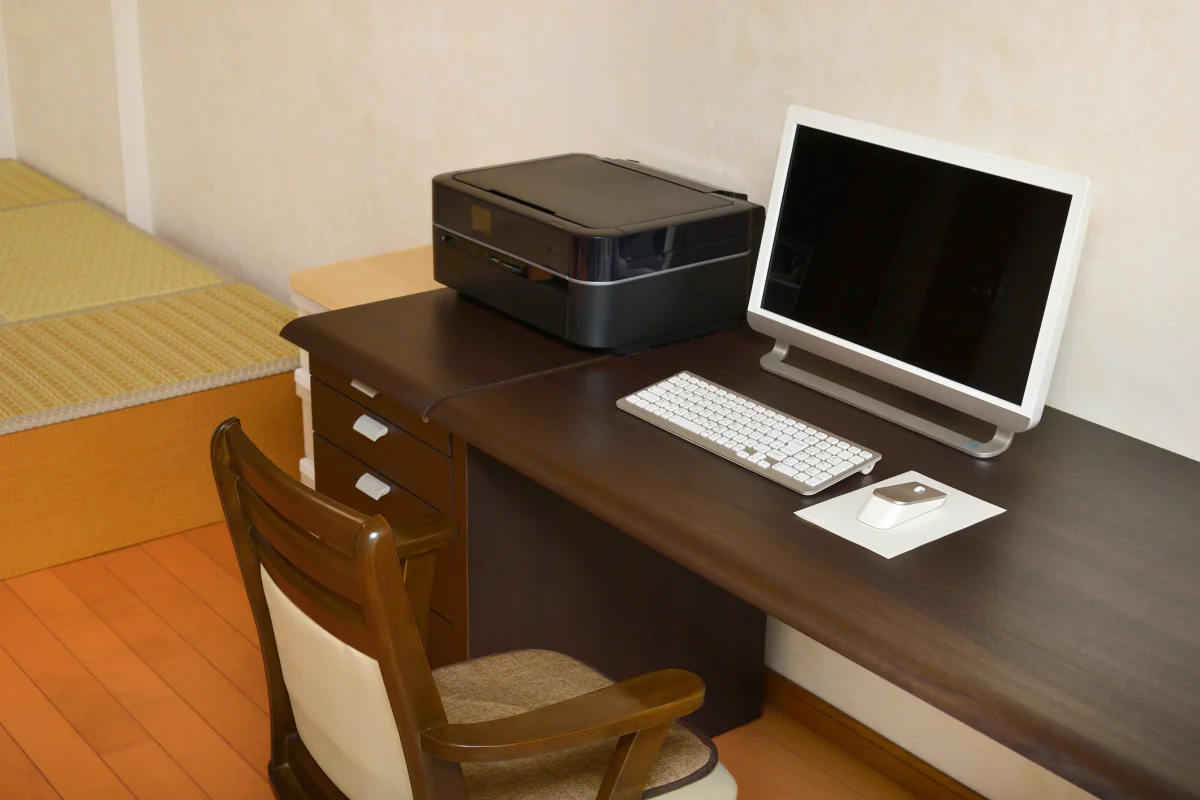 Temporary office equipment package with printers, copiers, and scanners staged for short-term business use