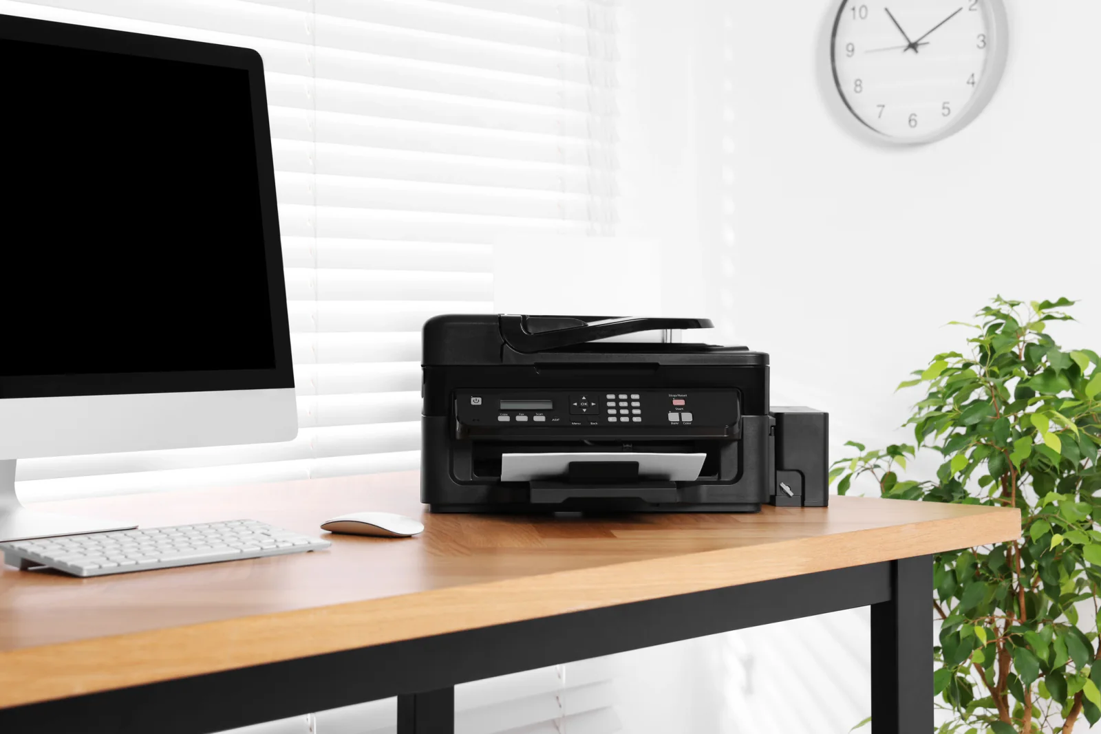 Laser printer on a desk printing office documents for temporary business and event operations