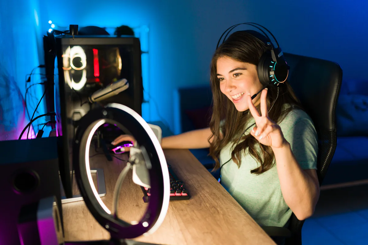 Gaming and streaming accessory setup with headset, keyboard, mouse, and capture tools for temporary event use