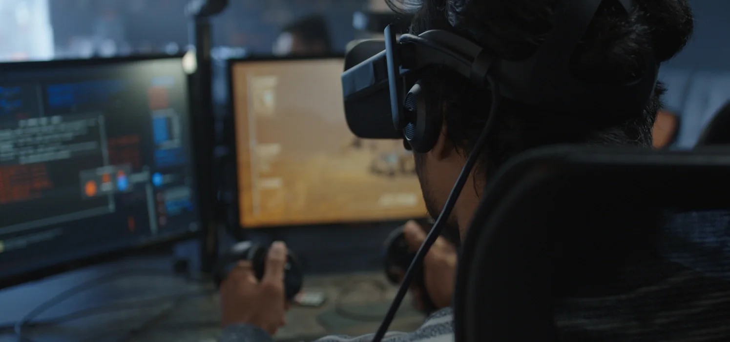 Row of esports stations with peripherals, gaming accessories, and player-ready temporary setups