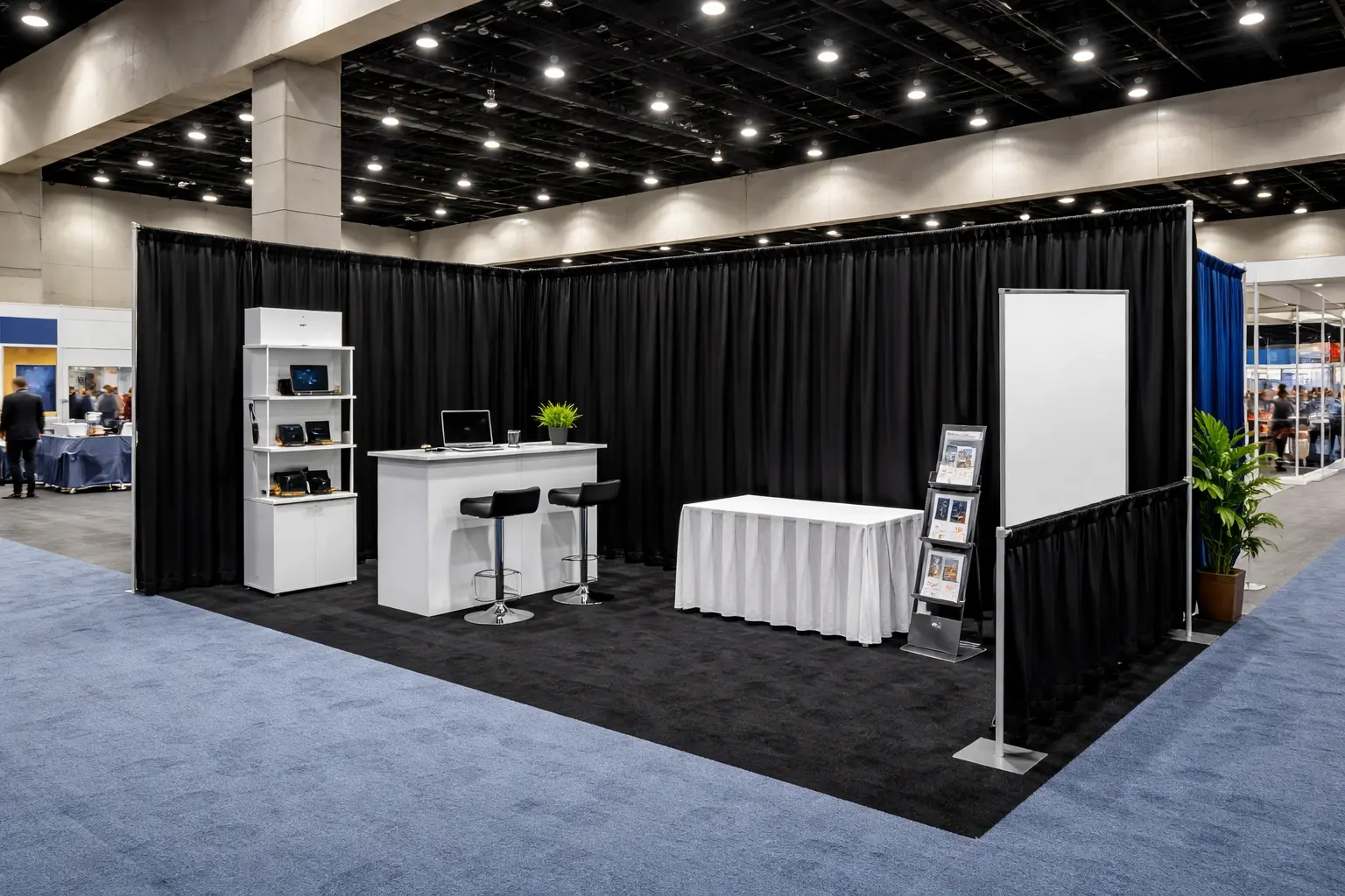 Pipe and drape used in a trade show booth for storage concealment boundaries and branded backdrops