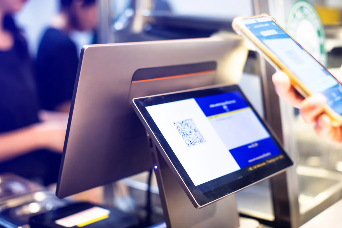 Event technology deployment at a conference venue with registration, displays, and attendee engagement hardware