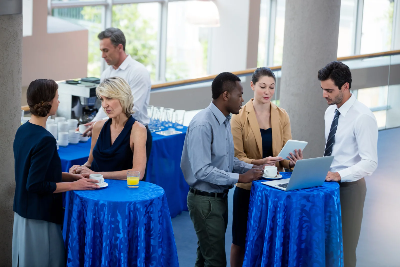 Trade show registration and exhibitor badging desk using rental tablets, printers, and staff stations to manage event entry workflows