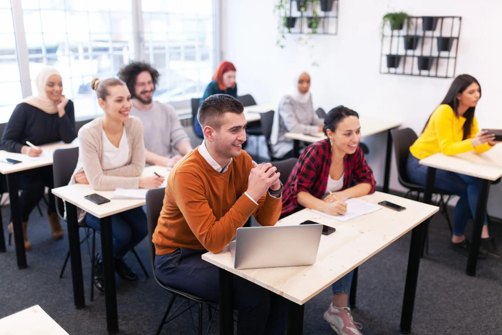 IT support team provisioning classroom laptops with standardized software and settings before a training or onboarding program
