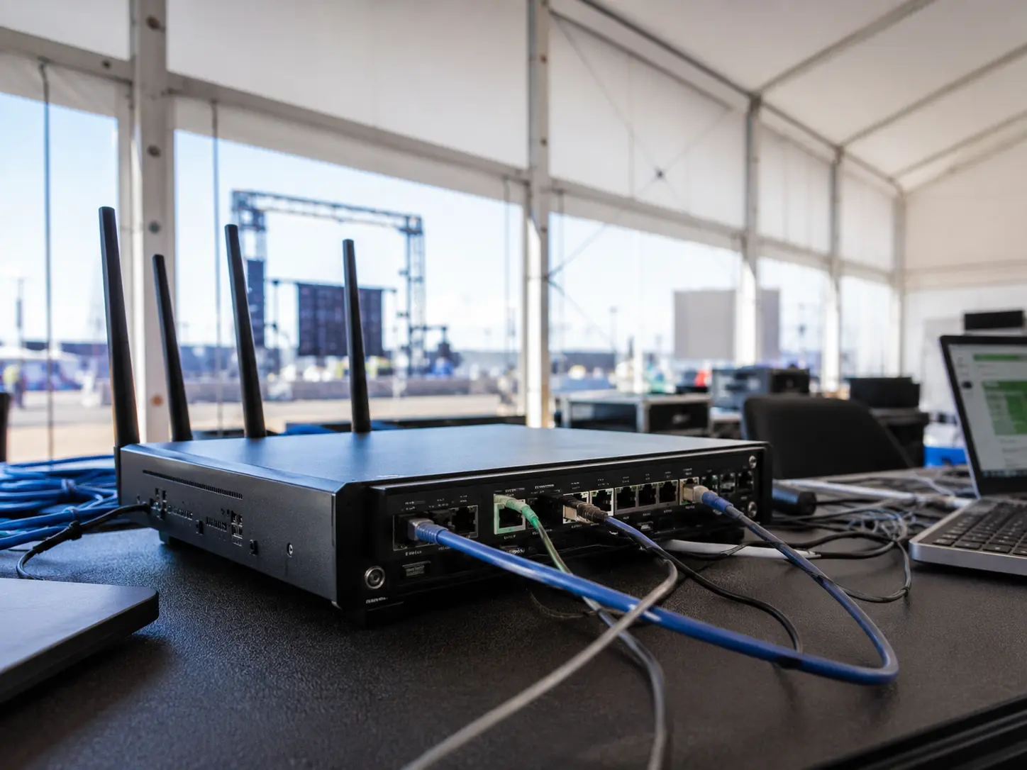 Pepwave enterprise cellular router with antennas deployed for temporary event connectivity failover internet and managed wireless networking