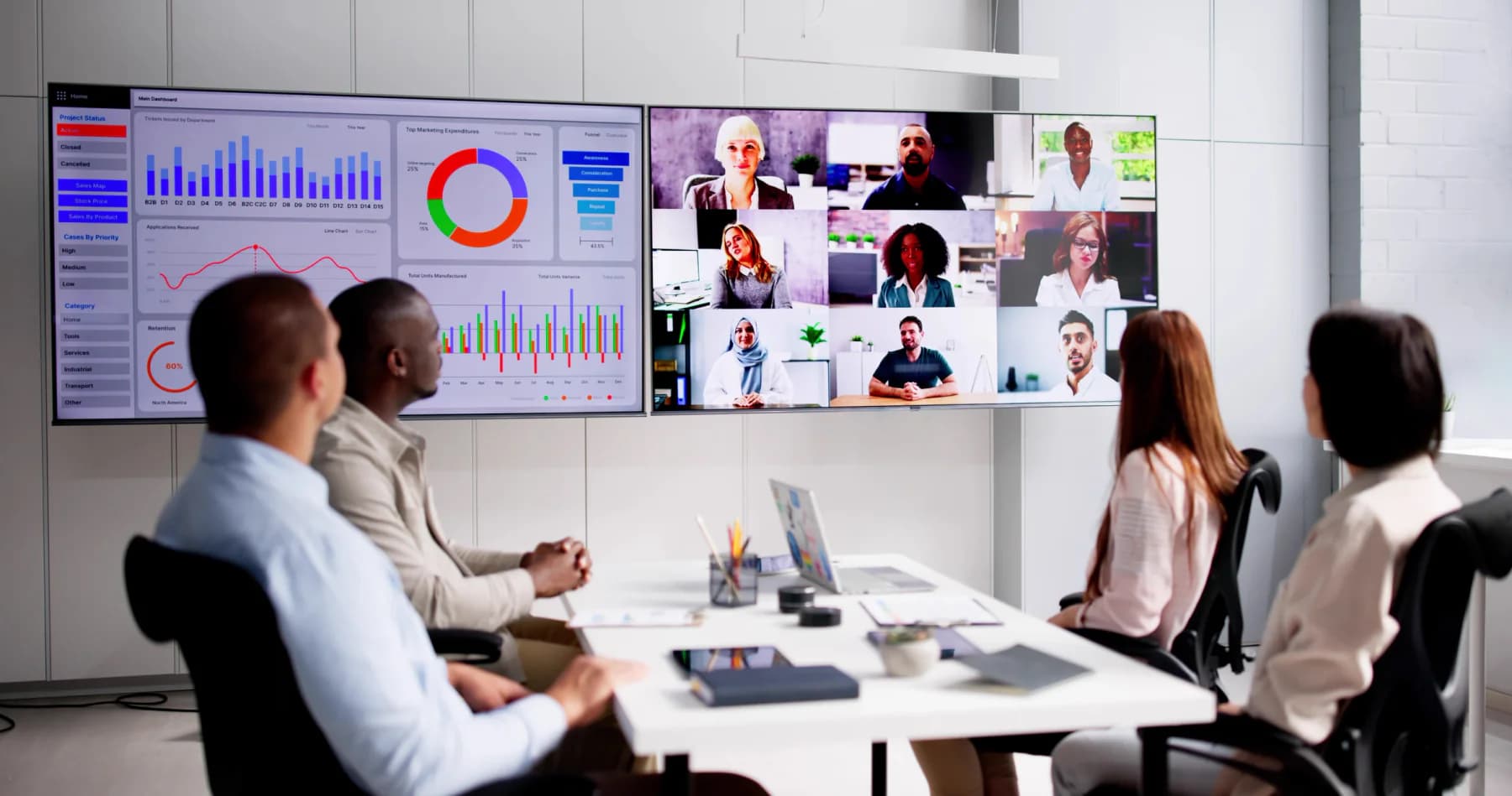 Business team using laptops, headsets, video meetings, and cloud communication tools in a temporary or transitional office environment