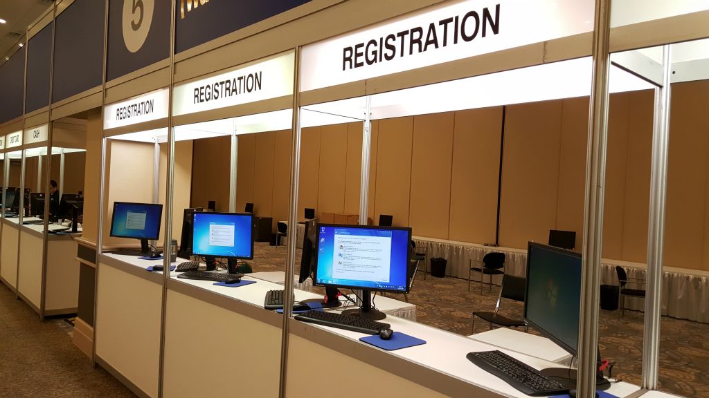 Rented desktop computers being used at an event registration