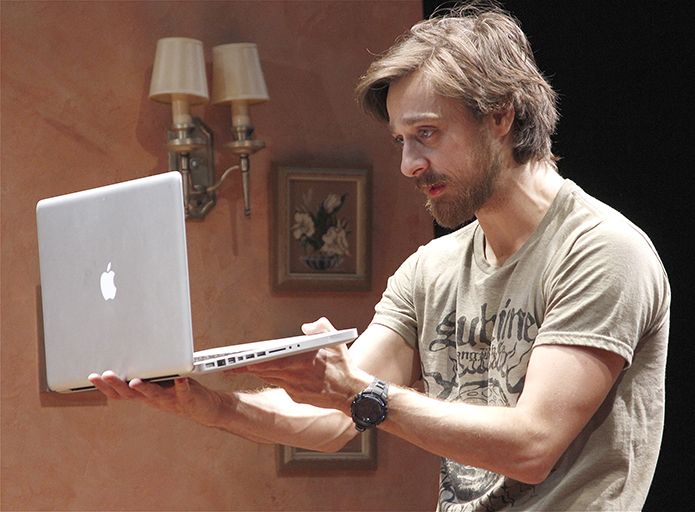 A man holding a rented MacBook Pro