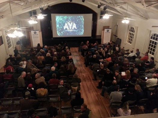 A rented projector and screen displaying at an event