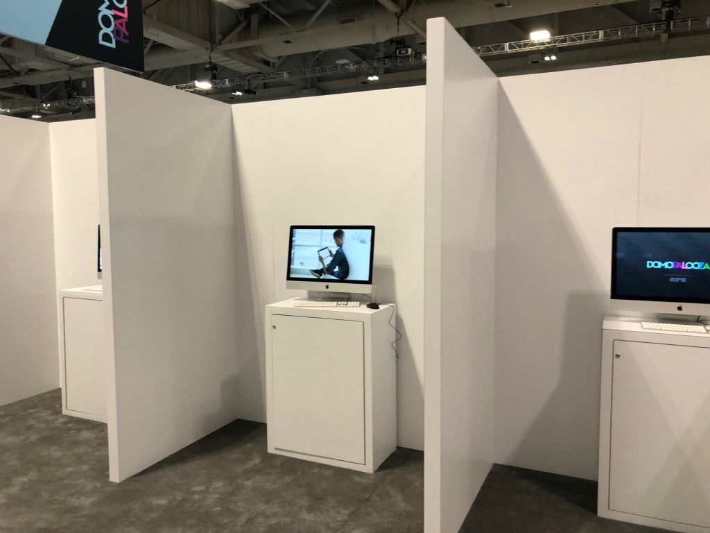 An Apple iMac set up in a convention booth