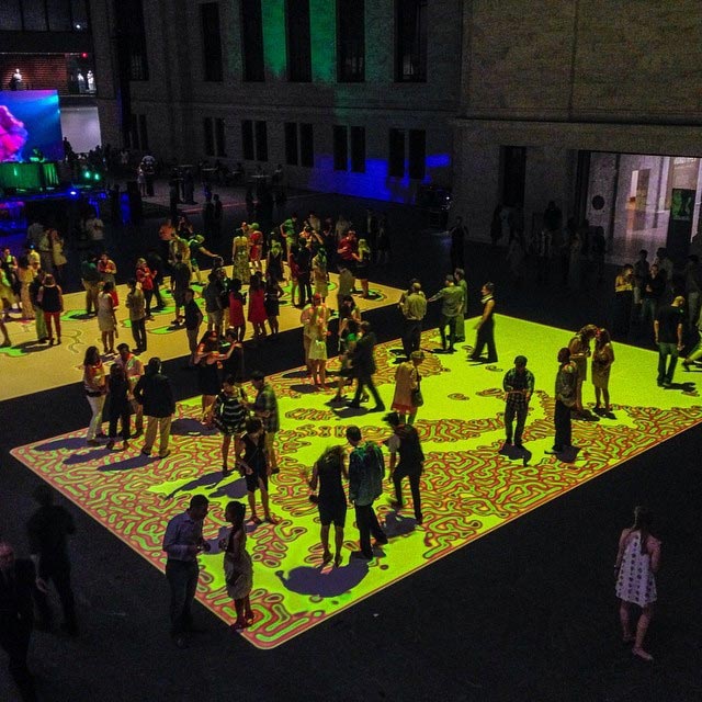 Mac Pros hooked up to a projector controlling moving images on the ground