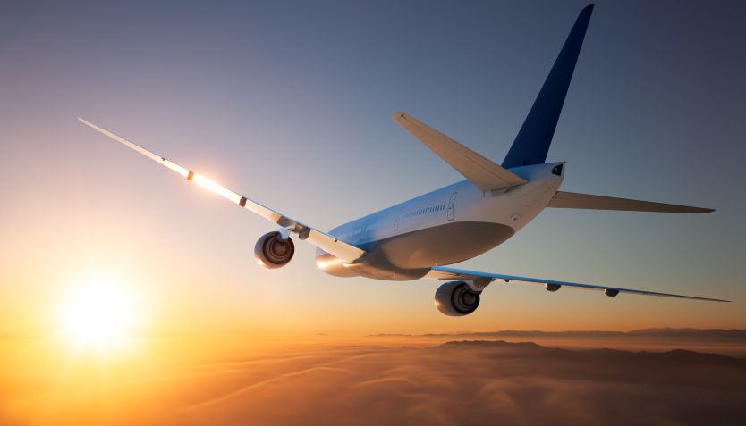 An airplane flying above a mountain range