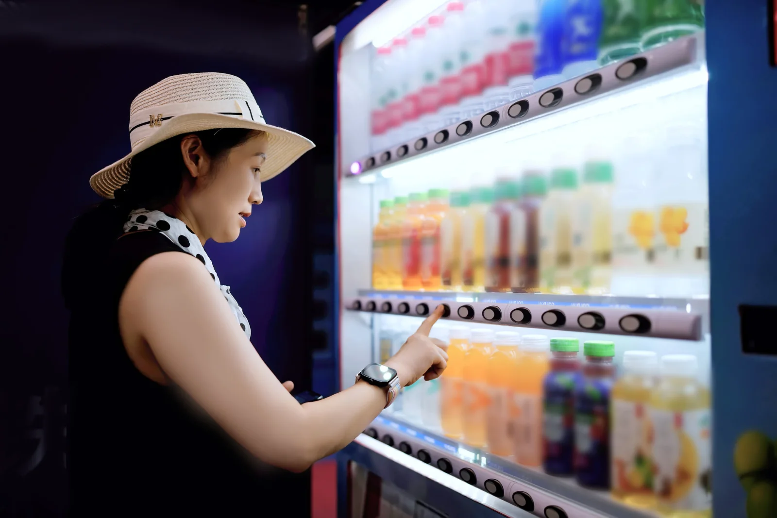 Employees using a branded vending machine at an internal company event or reward program