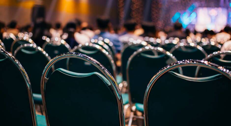 Convention Center Technology Rentals Lines of chairs facing a large stage