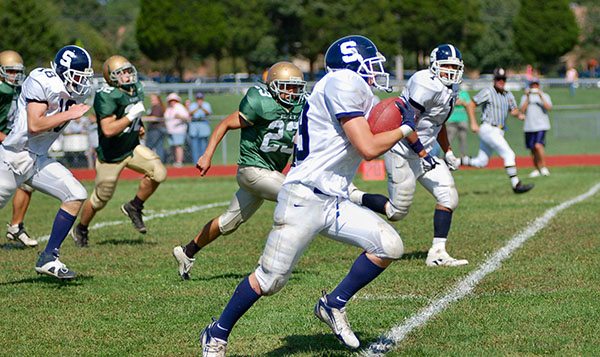 Sporting Event Rentals A football player rushing during a play