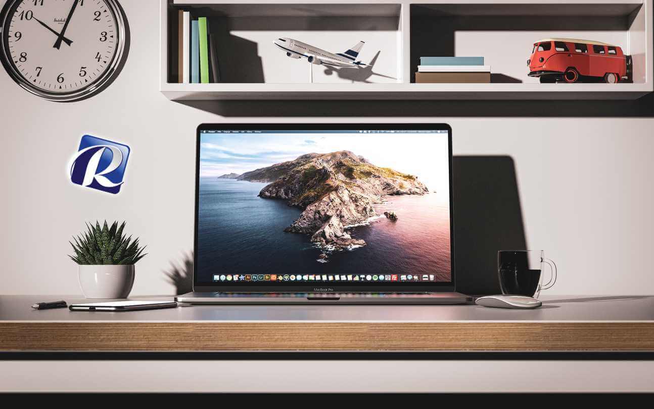 A powered on MacBook Pro sitting on a desk