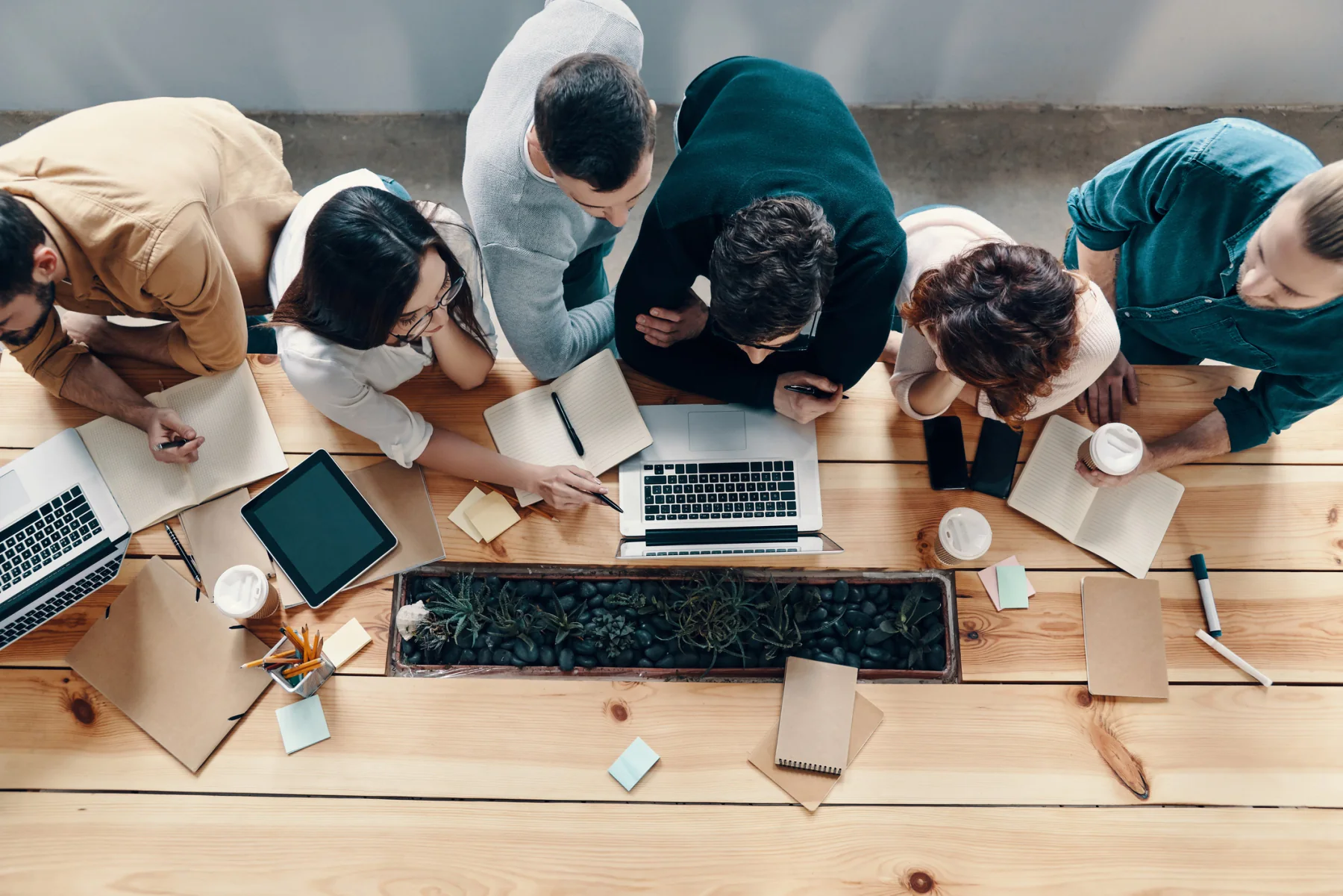 Developer team using rental laptops, tablets, and monitors for software testing and validation