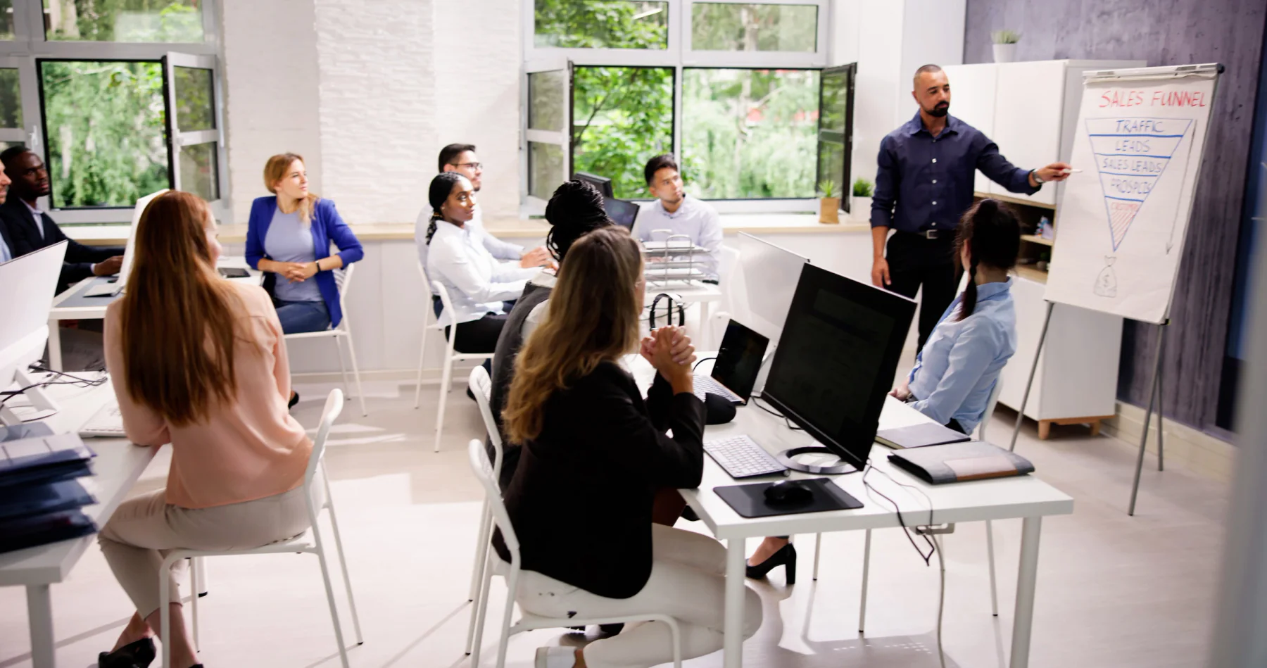 Training room with laptops, instructor display, and technology prepared for participants
