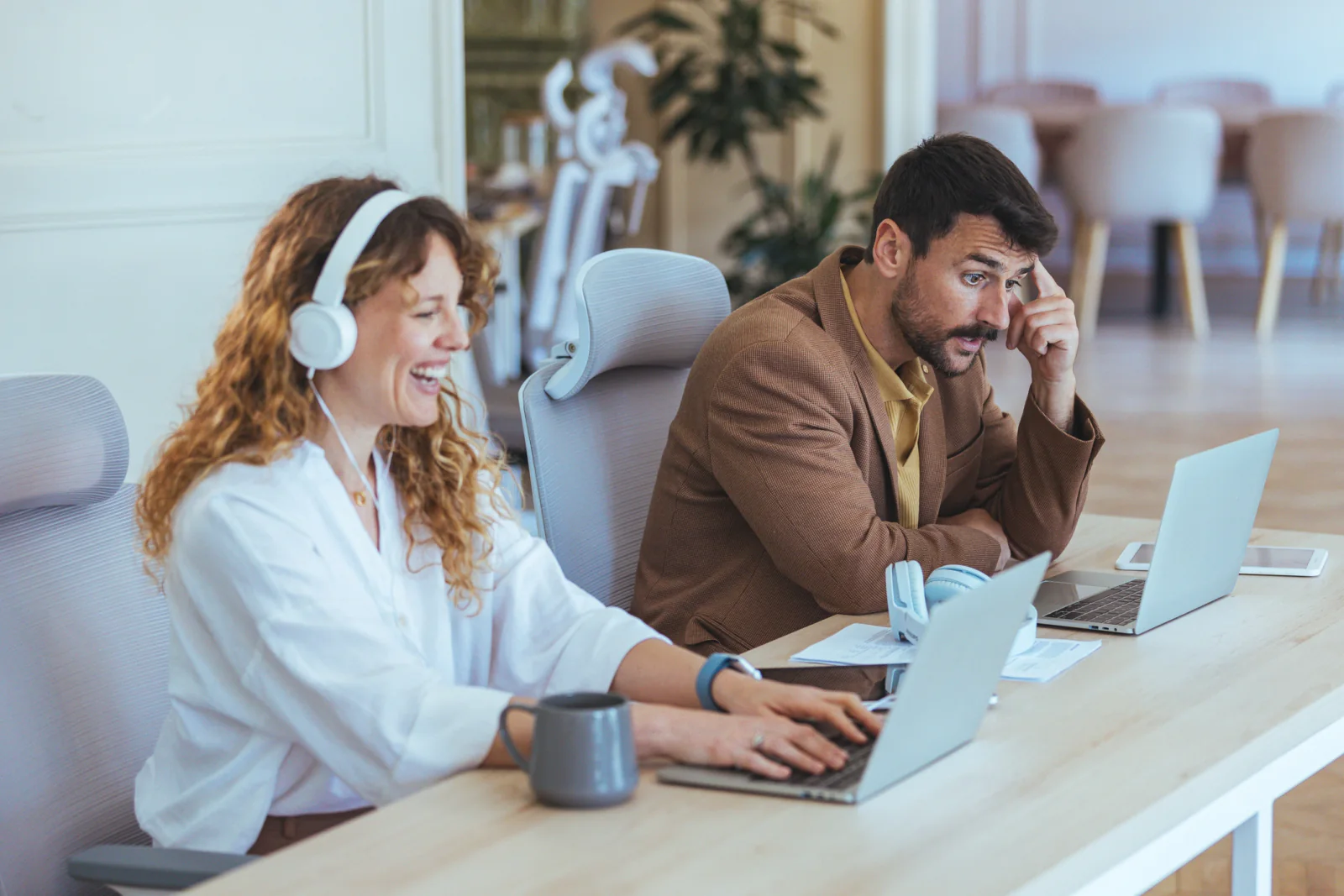 Distributed business team using laptops, video meetings, headsets, and cloud collaboration tools across multiple remote locations