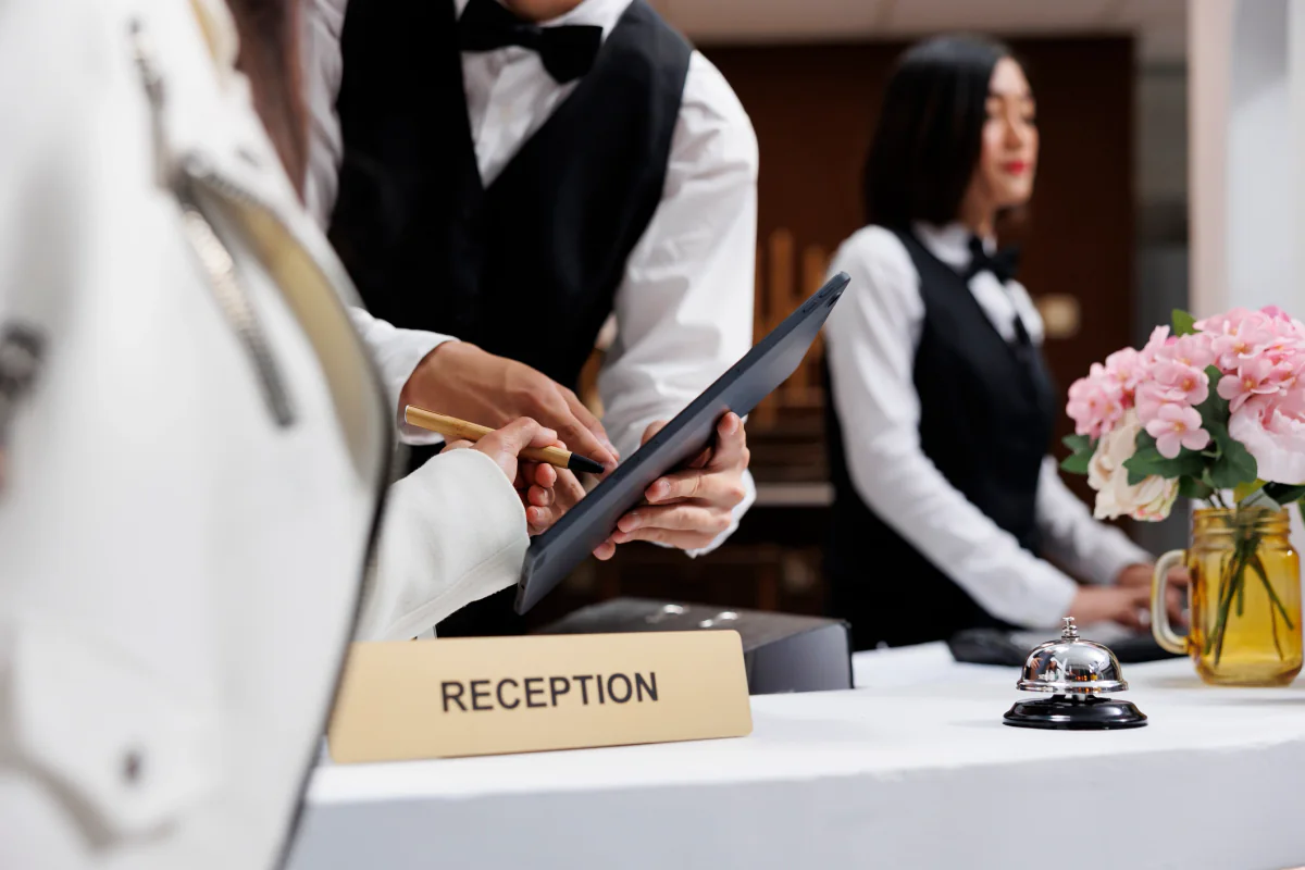 Tablet in a tabletop stand on a reception desk for check in, front desk use, and attendee interaction