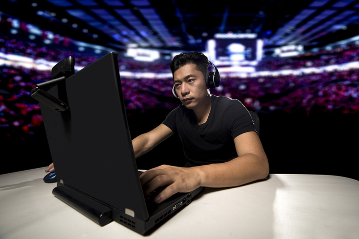 Person Playing Laptop At Gaming Event