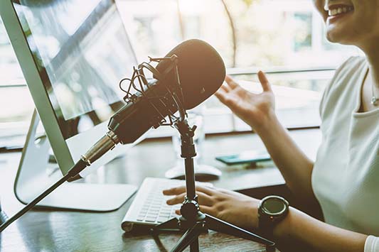 Lady Using a Podcast System